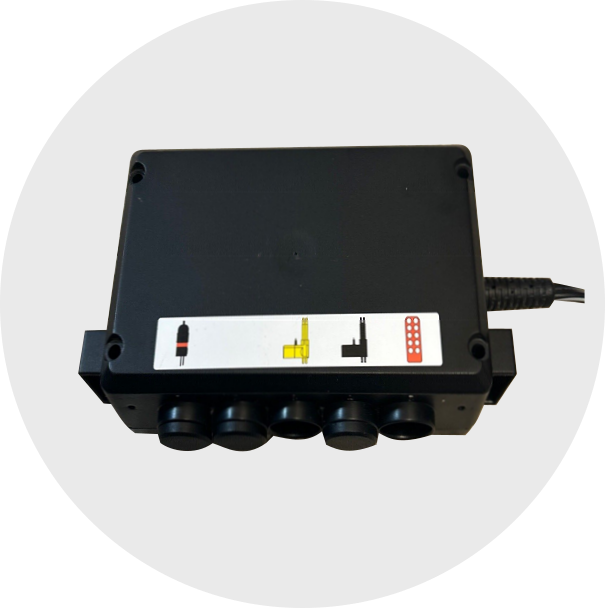 Black colored control box with slots for pins